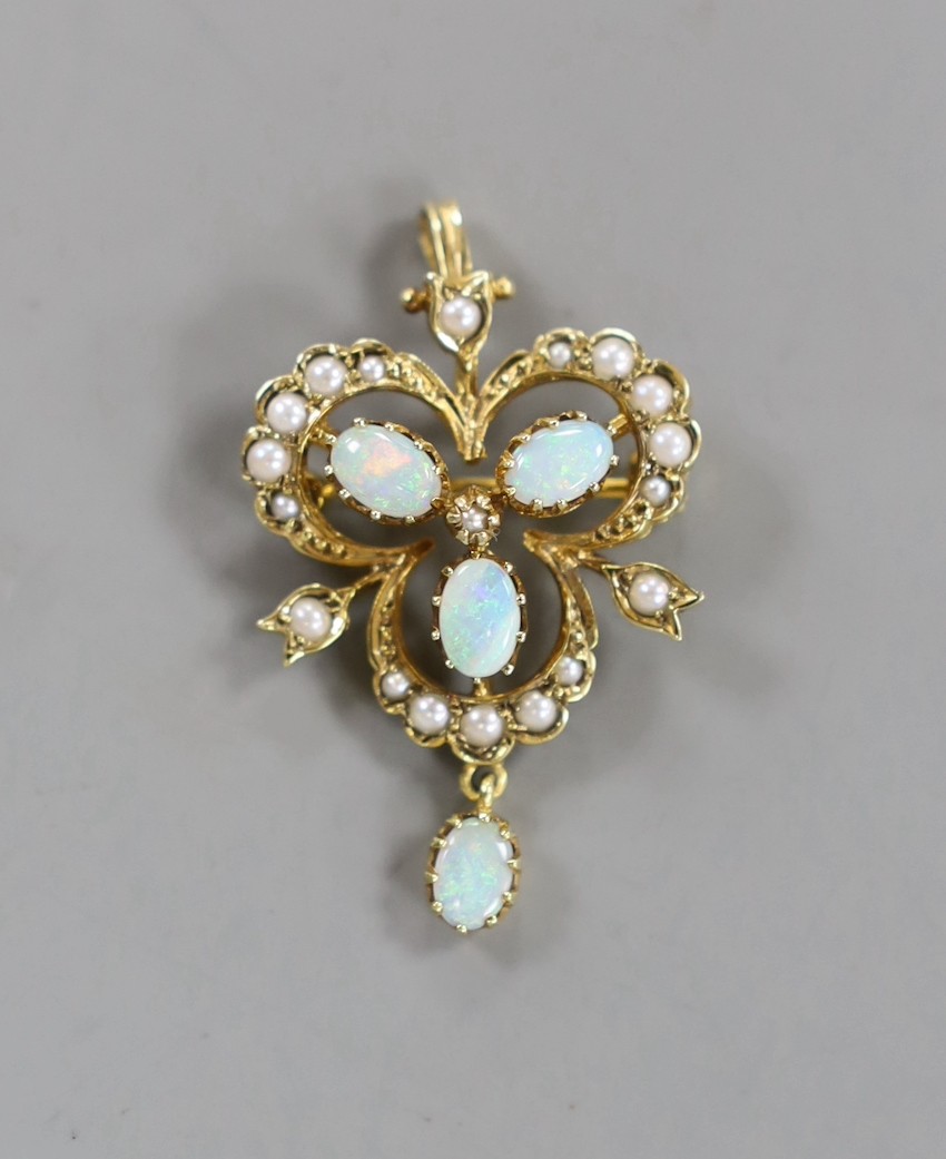 An Edwardian style 9ct gold, white opal and seed pearl set drop pendant brooch, overall 39mm, gross weight 4.9 grams.